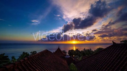 Sunrise Overlooking The Roofs Of The Bungalows And The Ocean in Bali by Timelapse4K