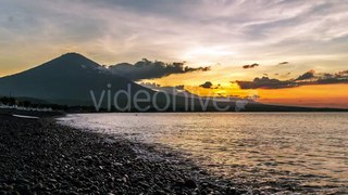 Sunset in Ocean And The Volcano Gunung Agung in Bali, Indonesia by Timelapse4K
