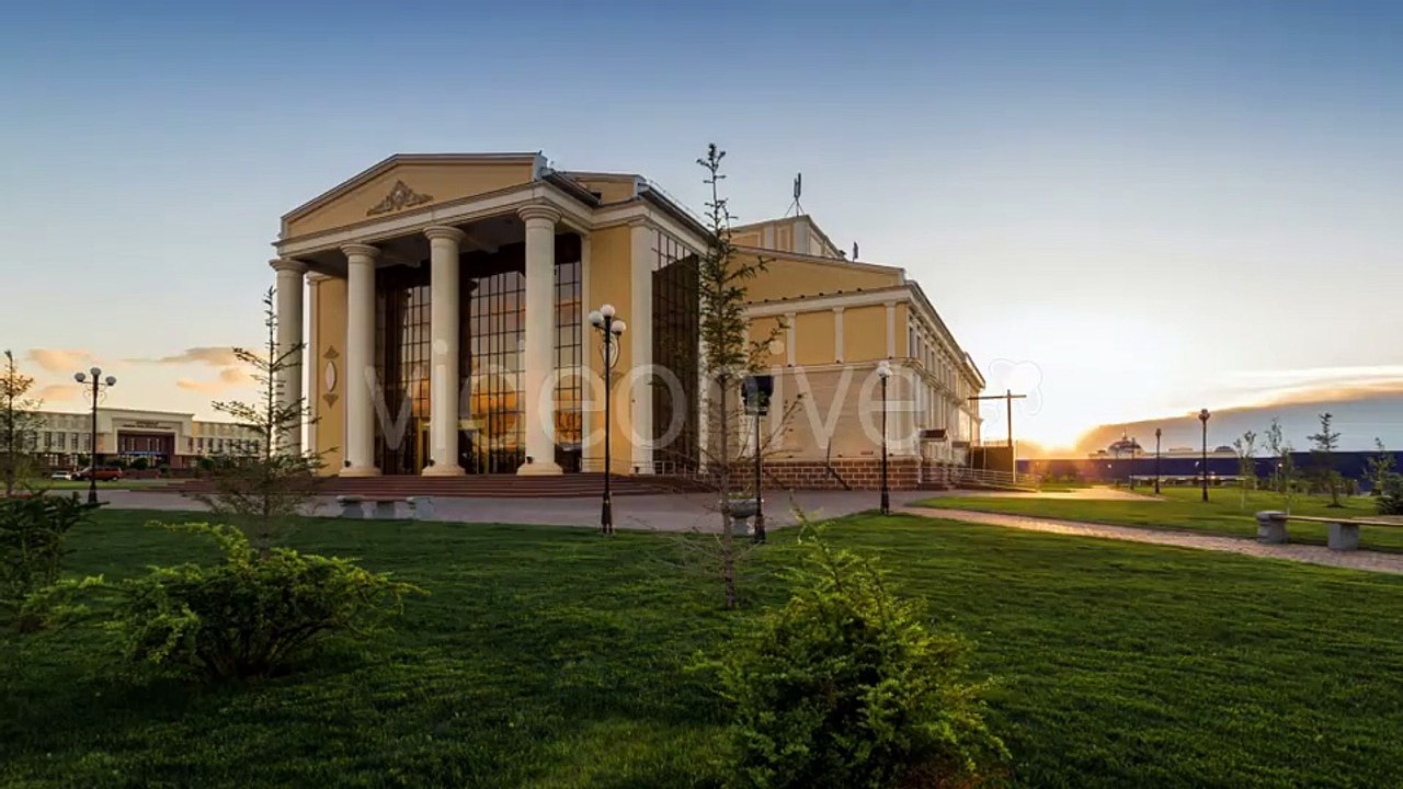 Sunset On a Background of Drama Theater Building. Kazakhstan by Timelapse4K