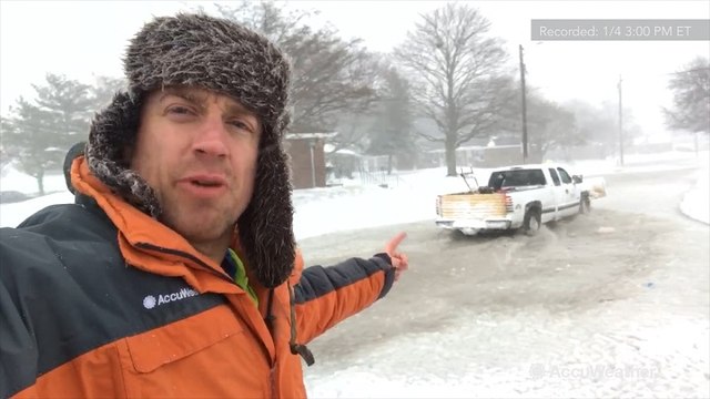 Blizzard conditions continue, roads covered in icy slush due to coastal flooding