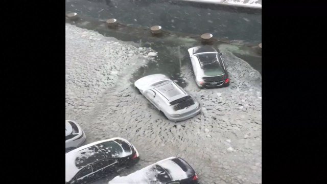 Boston driver attempts to escape 'bomb cyclone' flooding