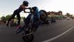 Crazy girl does motorcycle stunts on main road