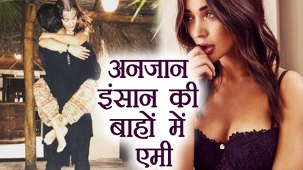 Amy Jackson Jumps and Hugs a MYSTERY Man; Check out here | FilmiBeat