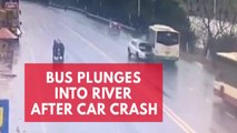 Bus plunges into river after car crash in China