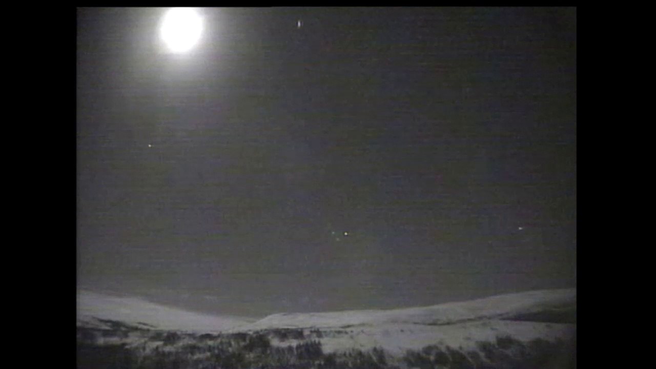 Meteor next to the moon