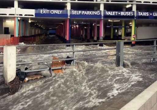 Floodwaters Rush Through Las Vegas Parking Lot After Unusual Rainfall