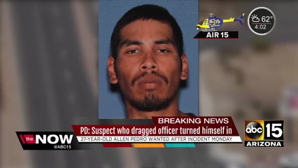 Suspect who dragged officer turns himself in