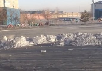 Black Snow Covers Children's Playground in Temirtau