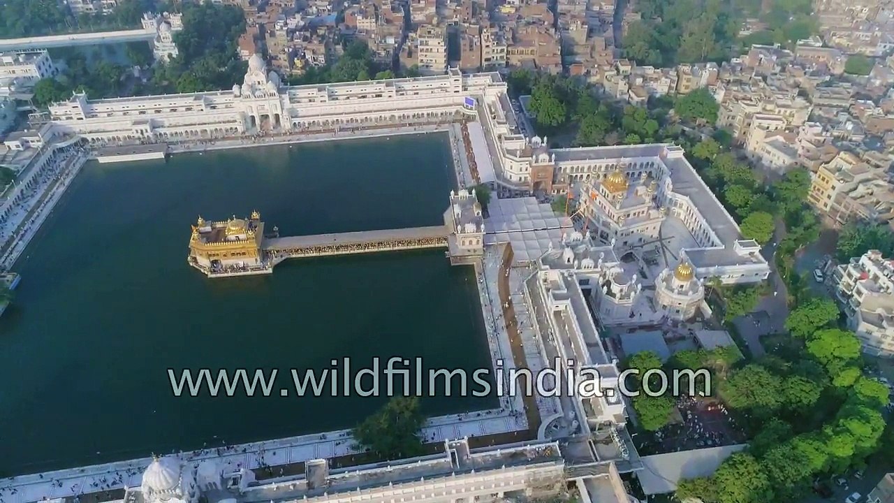 Fly over Amritsar: Golden Temple, old city, railway station and trains from the air