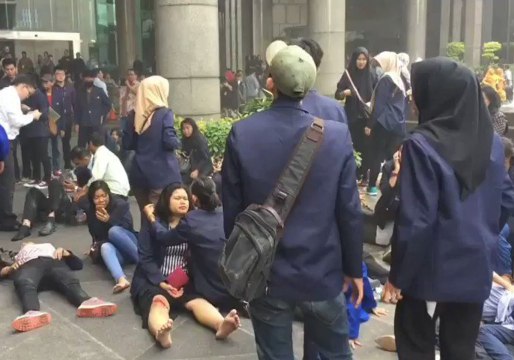 Injured Await Help Outside Jakarta Stock Exchange After Floor Collapse