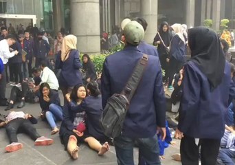 Injured Await Help Outside Jakarta Stock Exchange After Floor Collapse