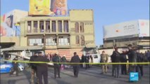 Deadly twin suicide blasts rock Baghdad square