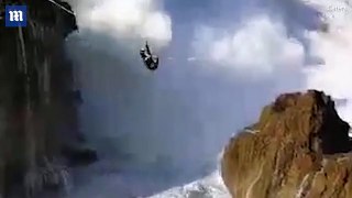 'Crazy' slackliner is knocked over by huge waves