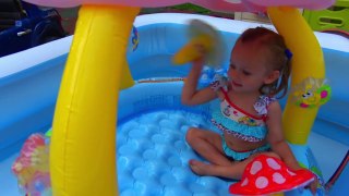 Funny Baby playing with Watermelon in pool
