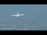 RAW: American Airlines Boeing 777-300ER flies over Sydney Harbour