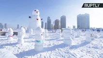 Chineses fazem mais de 2 mil bonecos de neve