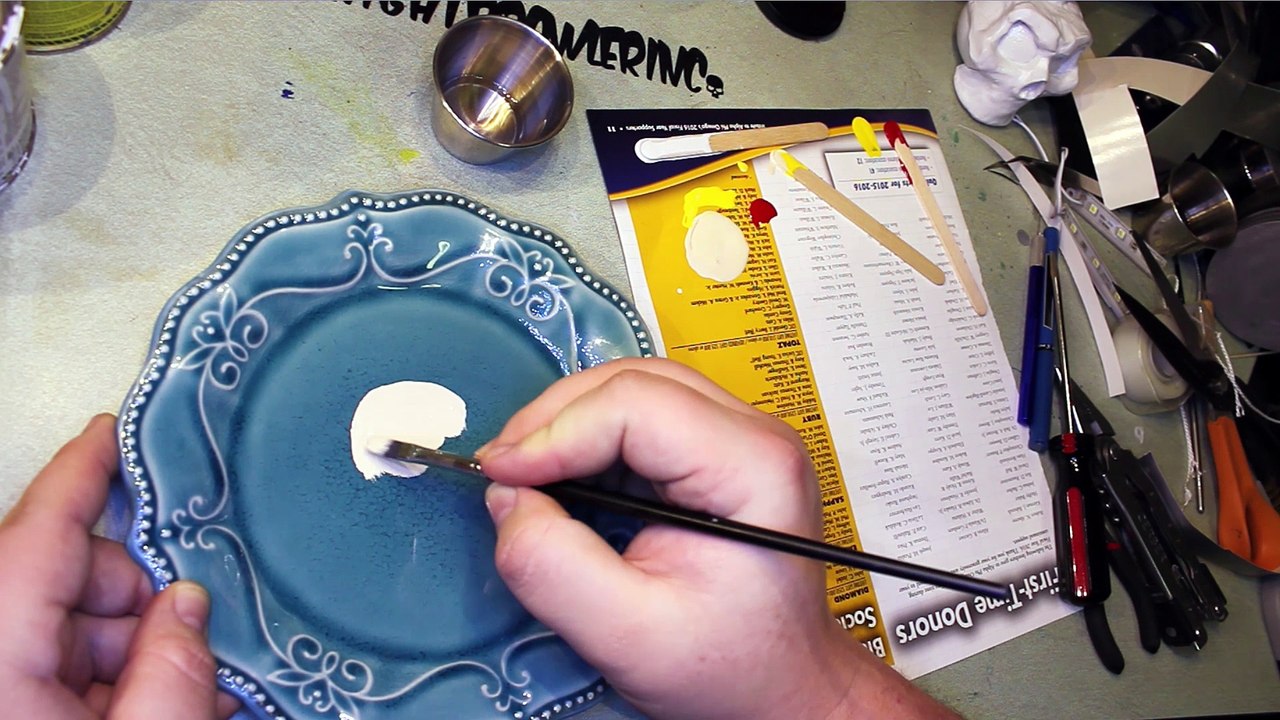 Painting a plate, custom skull work.