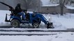 LS MT125 Tractor Clearing Snow 