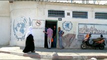 US cuts UNRWA funding by more than half