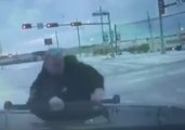 Texas Police Officer Slips, Slides on Ice While Directing Traffic