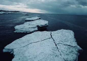 Aerial Footage Captures Lake Michigan Icebergs and Lighthouse