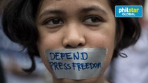 College students participate in a protest to defend press freedom.