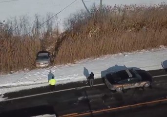 Driver Escapes Injury After Car Veers Onto Frozen Pond