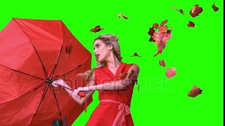 stock-footage-pretty-glamour-woman-holding-a-broken-umbrella-on-green-screen-in-slow-motion