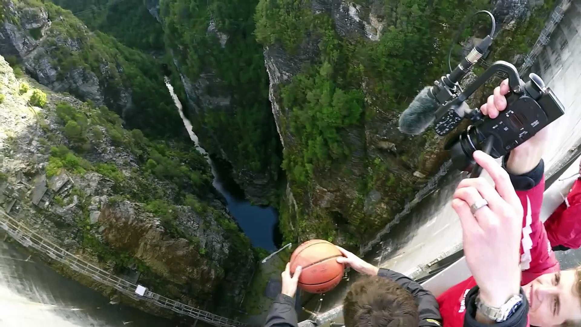 What Happens When a Spinning Basketball is Thrown Off a Dam!