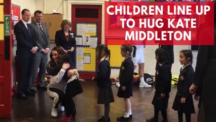 Children line up to hug Kate Middleton