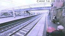 CCTV appears to show heroic woman saving man from oncoming train.