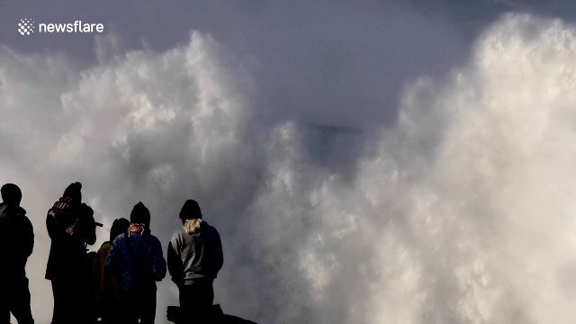 Big wave surfers ride monster swell off Nazaré