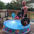 Guy Lifts Barbell in Kiddy Pool