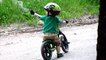 Toddler Rides Balance Bike Around Park