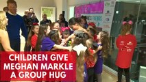 Meghan Markle receives group hug from school children