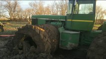 John Deere 8850 Tractor Stuck in Muddy Field in North Dakota Pulled Out by Another 8850