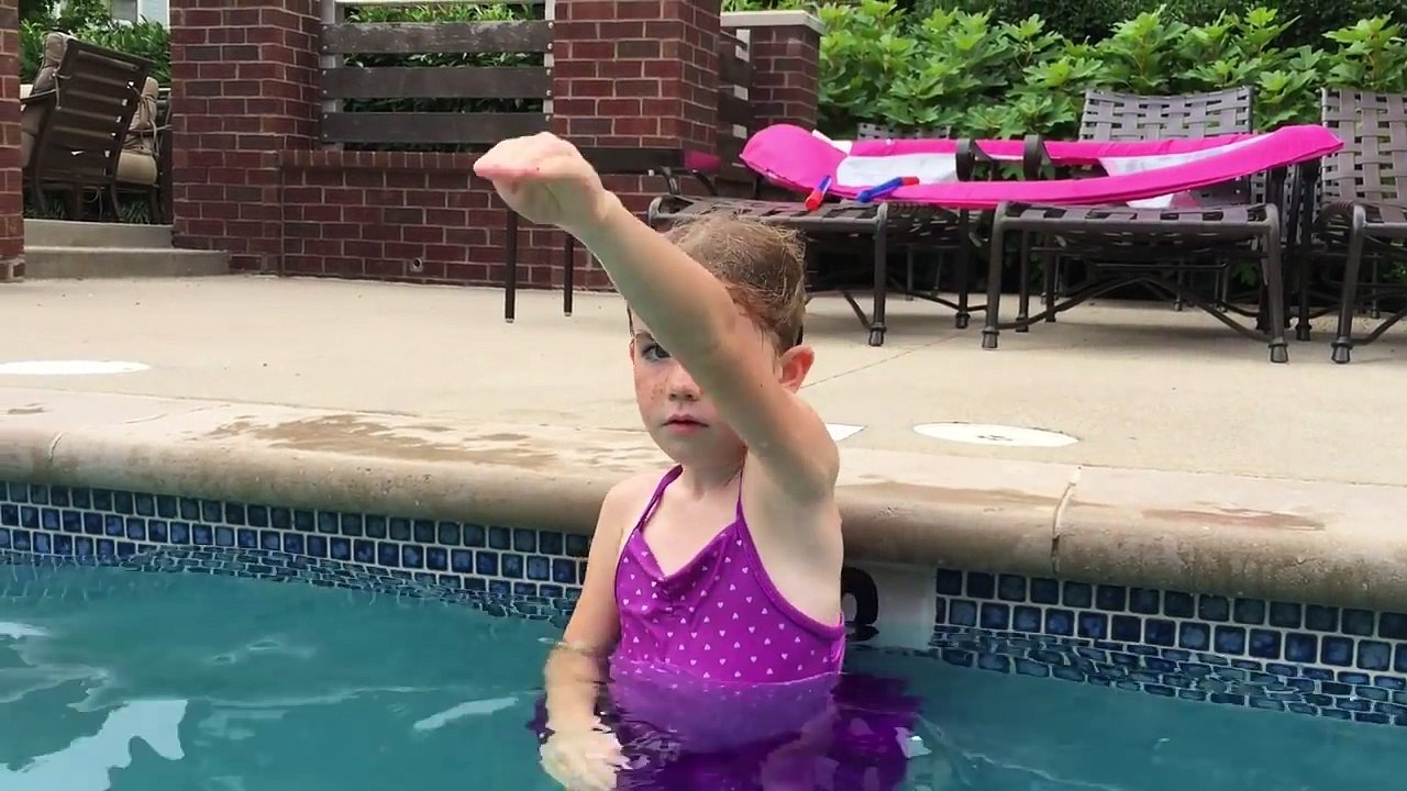 Kids teaching kids how to swim.
