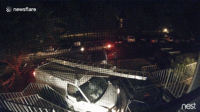 Security camera captures moment van smashes into parked truck