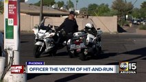 Suspect at large after hitting officer's motorcycle in Phoenix