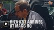 Dozens of cameras, but no red carpet, as Riza Aziz arrives at MACC HQ
