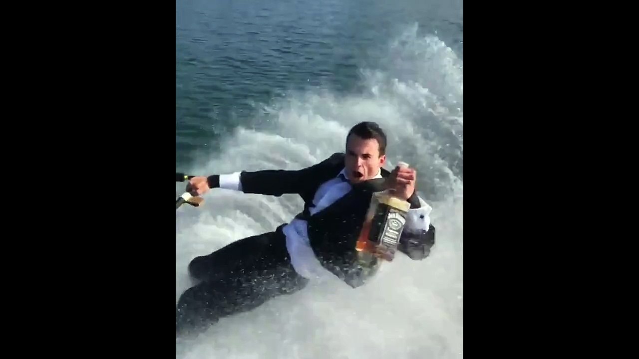 Guy Wakeboards In Suit While Drinking Jack Daniels