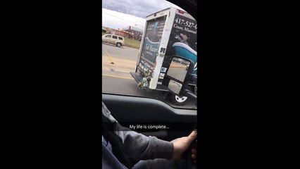 Guy films Buzz Lightyear and Sheriff Woody holding onto the back of a truck
