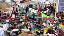 Dünya Gümrük Günü'nde alkol şişeleri kepçe ve silindirle ezildi - KARAÇİ