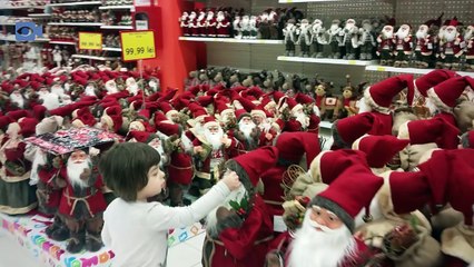 Baby discovering Christmas decorations in Jumbo