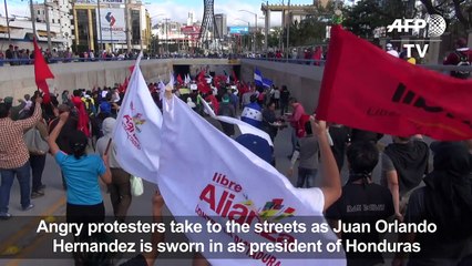 Honduras police fire teargas at protesters as Hernandez sworn in