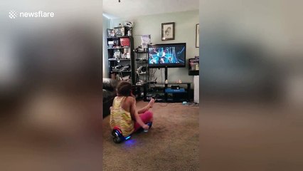 Little girl and baby brother smash into TV on hoverboard