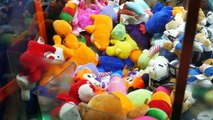 Playing claw machines for charity at Dave and Busters! | The Crane Couple