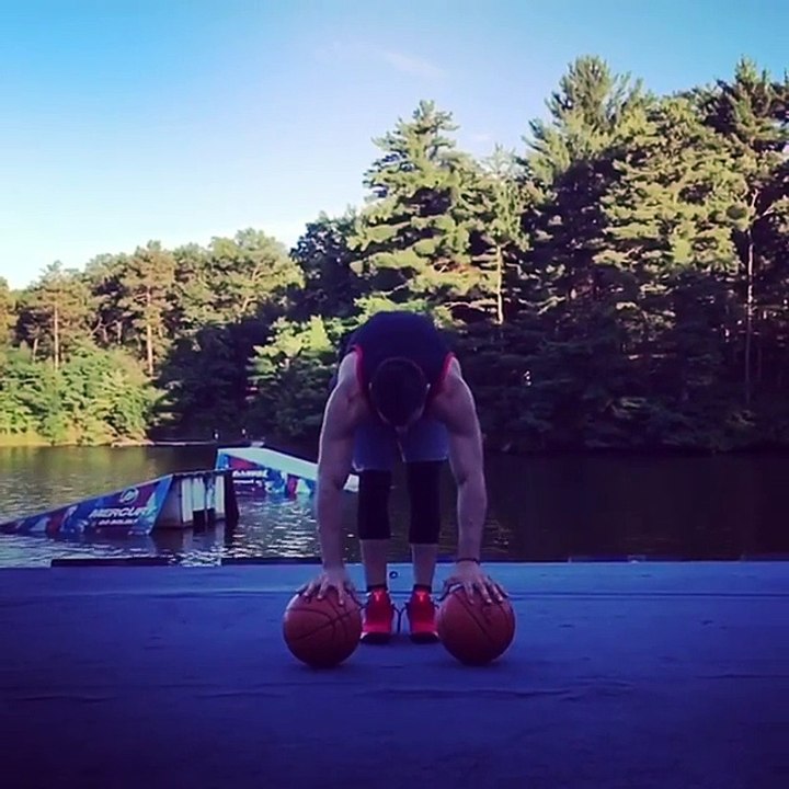 Guy Performs Handstand on Two Basketballs