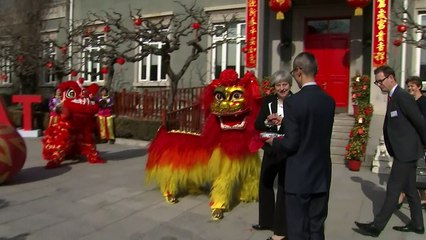 May dots eyes and drinks teas on China visit