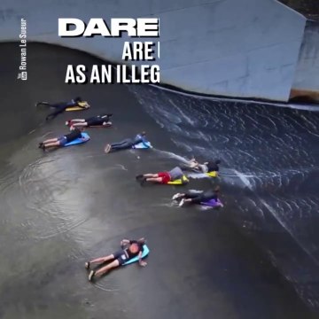 Ces fous descendent la pente d'un barrage en mode toboggan à eau